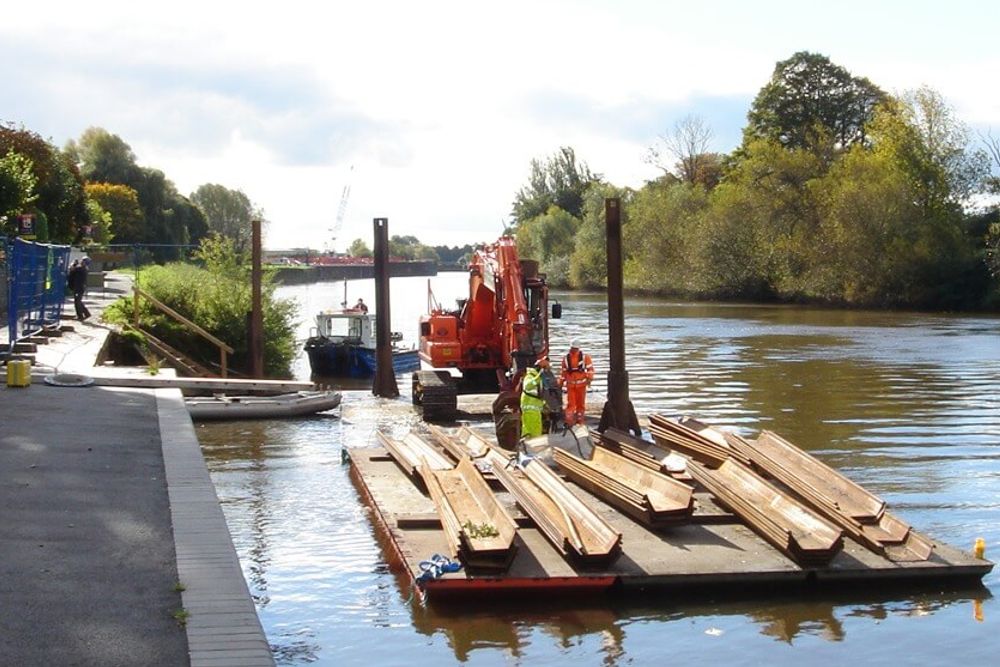 DAACE marine works taking place from a floating platform on a waterway