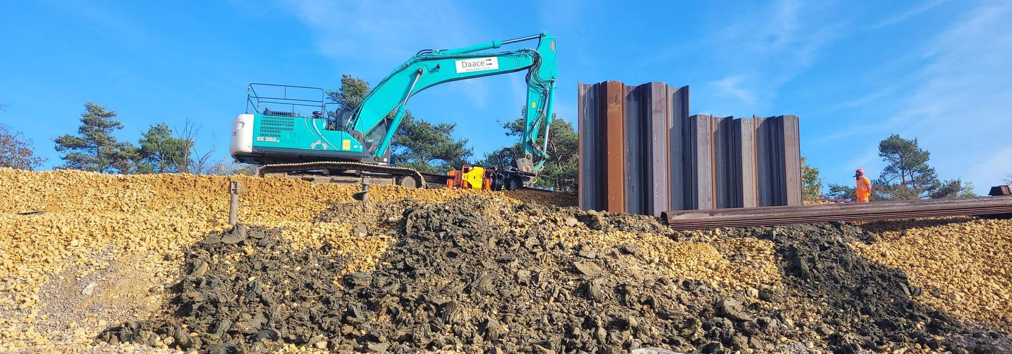 Sheet piling works with an excavator at a DAACE site