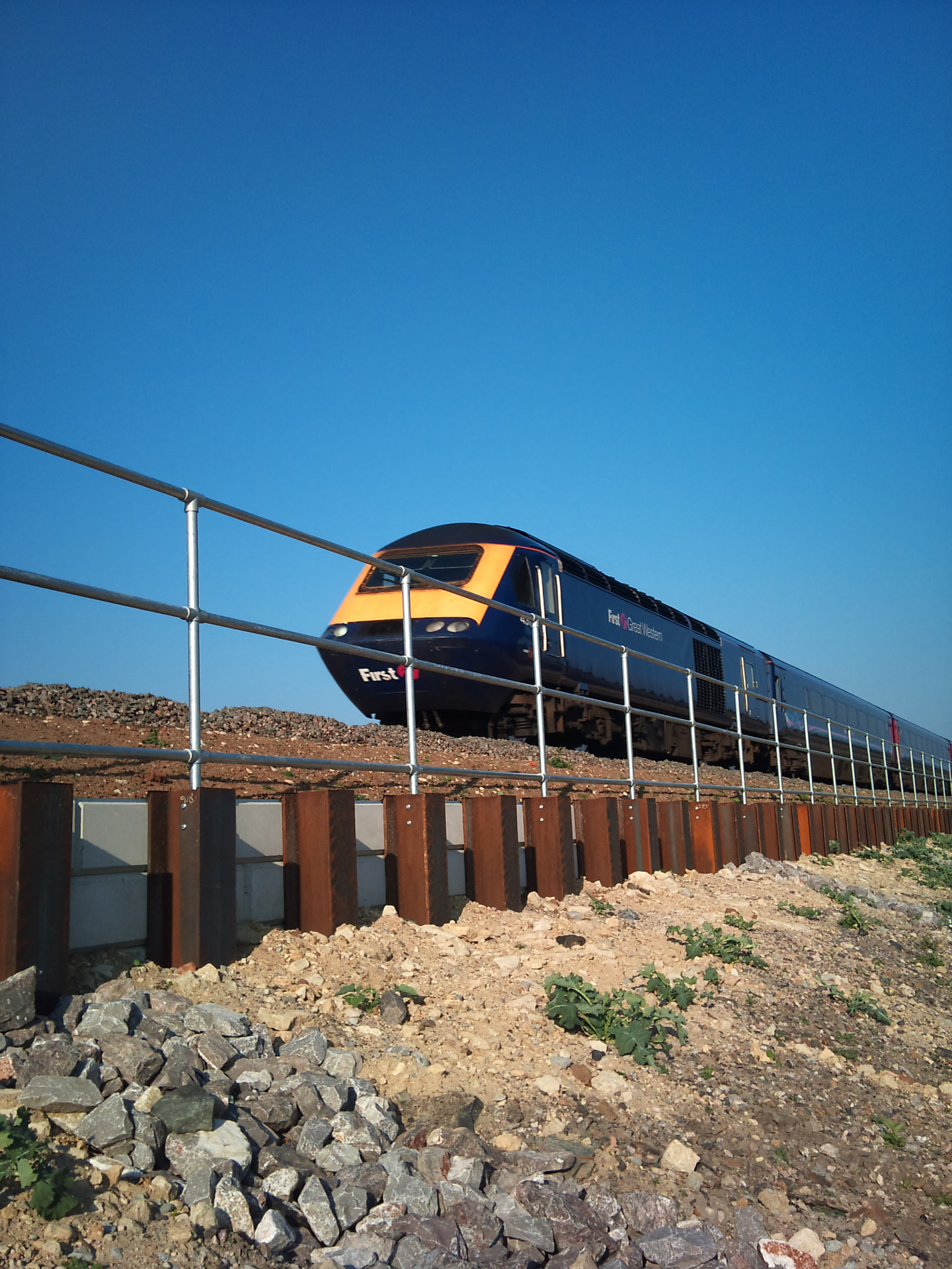 Completed precast retaining wall beside the railway