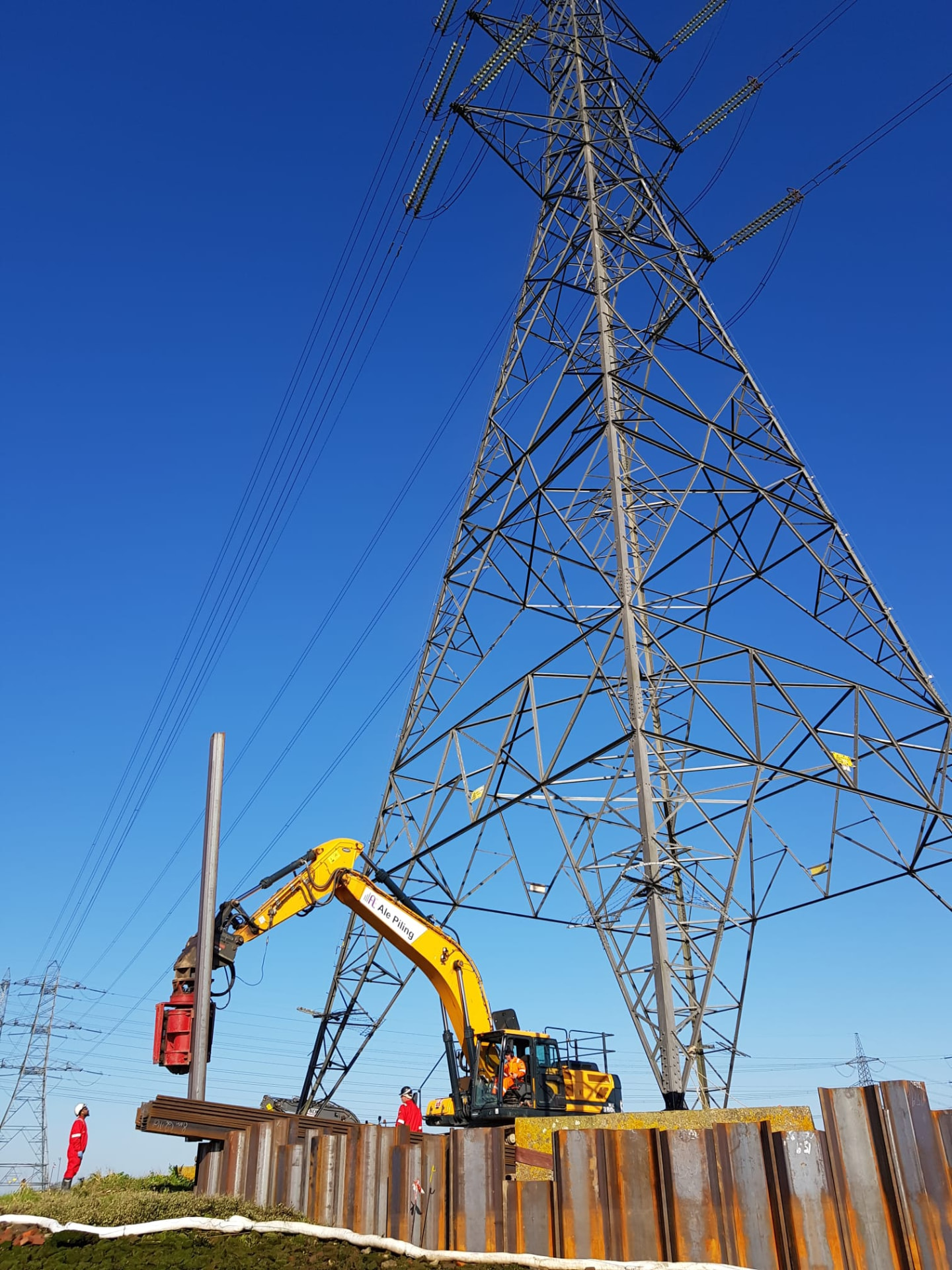 Sheet-pile installation beside the live pylon