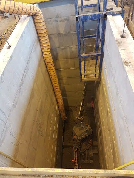 Concrete-lined shaft during excavation